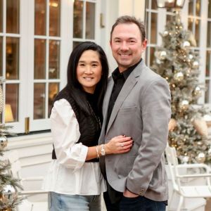 couple poses for portrait in  downtown carmel indiana 