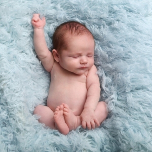 newborn baby on blue fur