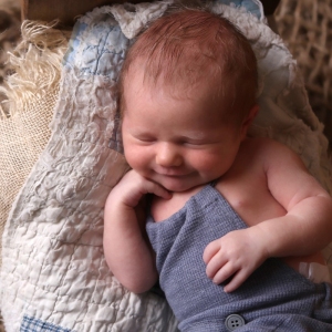 smiling newborn baby boy
