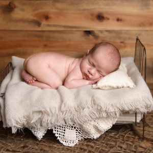 newborn-twin-photography-baby-on-bed