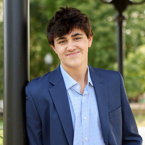 Boy poses for senior portraits in Carmel, Indiana