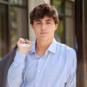 Boy poses for senior portraits in Carmel, Indiana