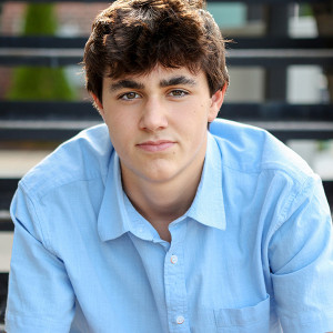 Boy poses for senior portraits in Carmel, Indiana