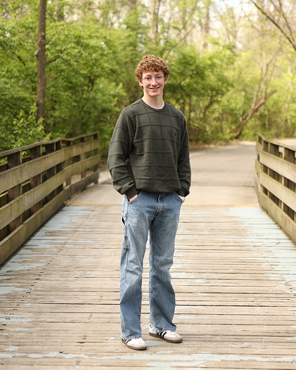 senior pictures of boy outdoors in carmel indiana