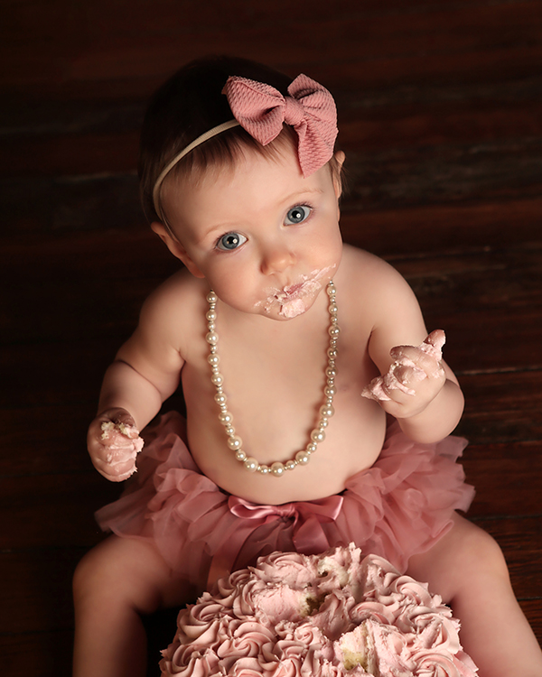Baby girl in pink ruffles at Indianapolis baby milestone photography session