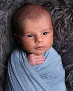newborn closeup photo with eyes wide awake