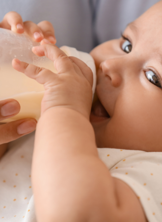 baby drinking from bottle