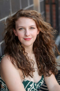 girl poses for senior portrait at Carmel City Center, Indianan