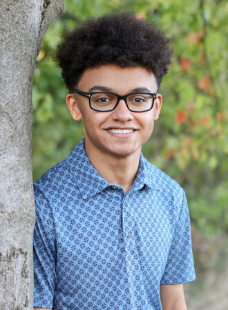boy posing for senior pictures at Japanese Garden in Carmel