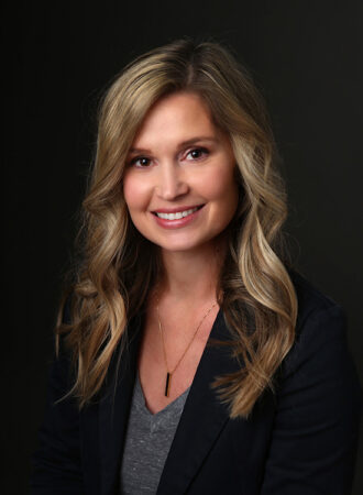 business headshot taken in Carmel, Indiana of woman on dark background