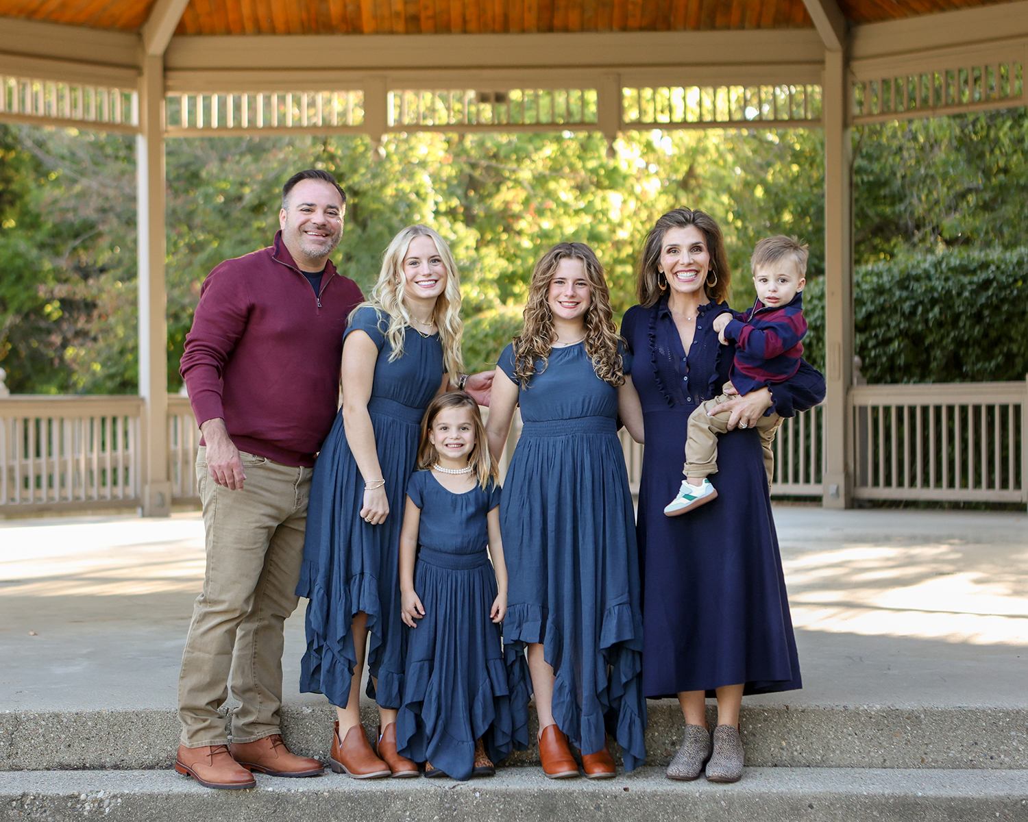 family poses together for portrait session in Noblesville Indiana