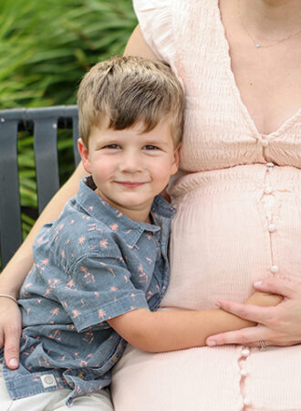 boy excited about baby sister's upcoming birth
