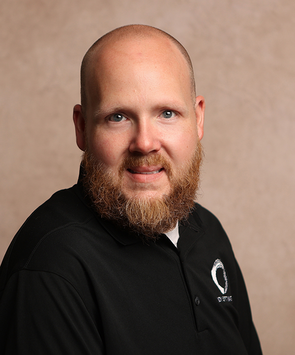 man poses for corporate photo