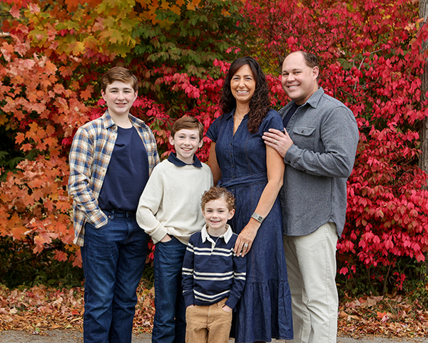 family posing for fall portrait in carmel